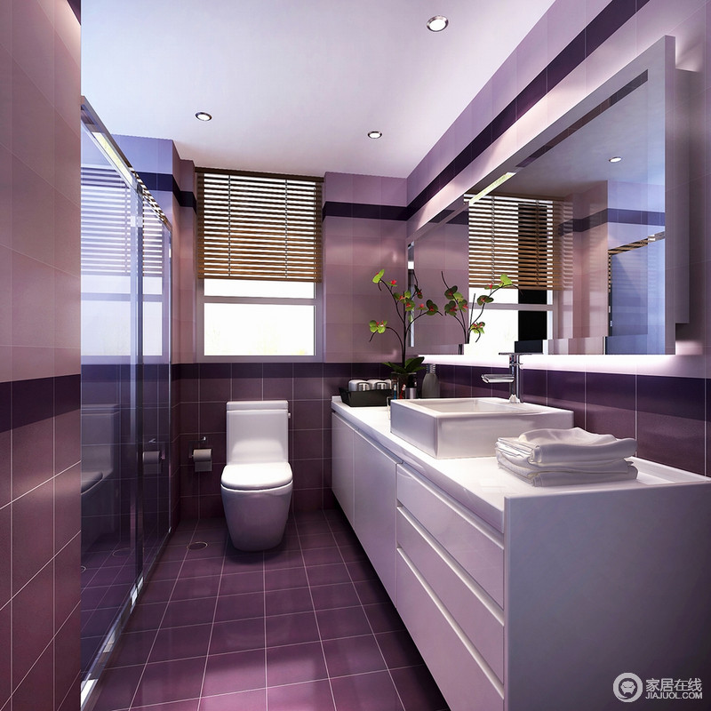 大面积的深邃魅力绛紫色，柔和了卫浴空间，提升了卫生间的格调和品味；搭配白色盥洗台，彰显出奢华气息。质感精致的浴室镜与分隔干湿区域的玻璃，使稍显逼仄的空间扩展增容。