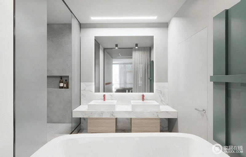 卫生间也是简约中透露着一种舒适与实用，盥洗区的灰色水泥调性格外沉寂；而白色盥洗区的两个台盆与一面镜子构成一种和谐，却让空间格外简雅。