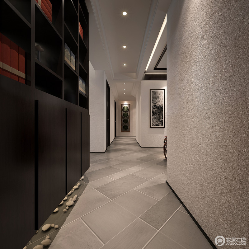 走廊中双色并行，灰白的墙面和褐木置物柜将空间的层次清晰地勾画出来的同时，增加了空间的实用性，并利用石块营造自然、放松的情境。