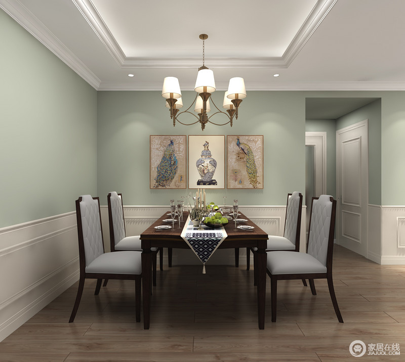 餐厅区域以造型护墙板进行围合，软装风格延续了客厅的复古感与清新，有质感地美式家具和挂画令用餐气氛温暖而精致。