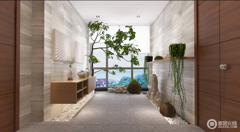 走廊区中结合中国山石造型的手法打造了一个充满自然情趣的空间，灰白的大理石墙面肌理层次过渡清晰，原木悬挂式柜子不仅节省空间，还打造了一个简约之风的园林之境。