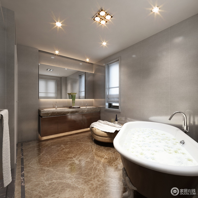 灰色墙面和大地色暗纹地砖围筑起空间，白色釉亮的浴缸邀你沐浴在这个现代的卫浴间呢。